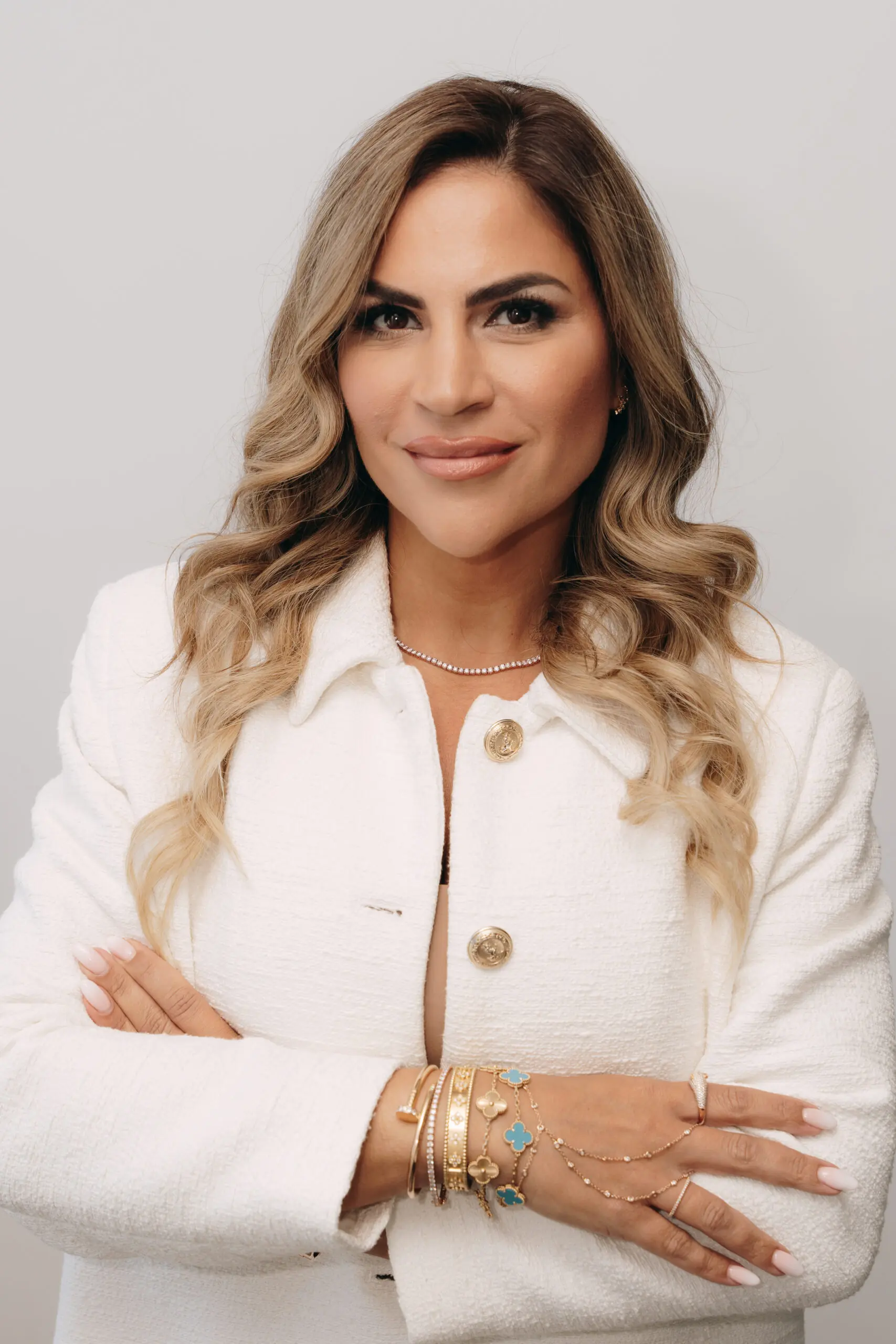Lillian Sedaghat, Esq headshot wearing a white blouse