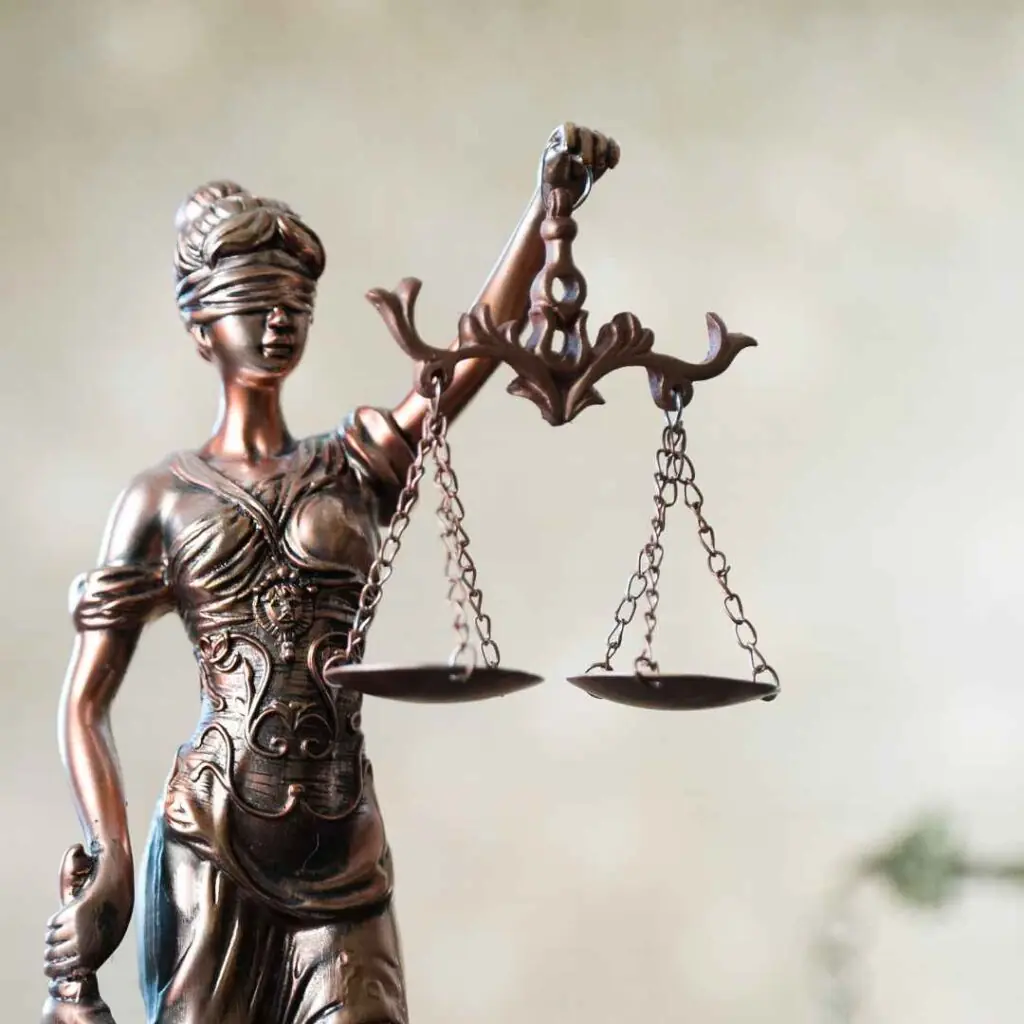 Lady Justice statue holding scales of justice.