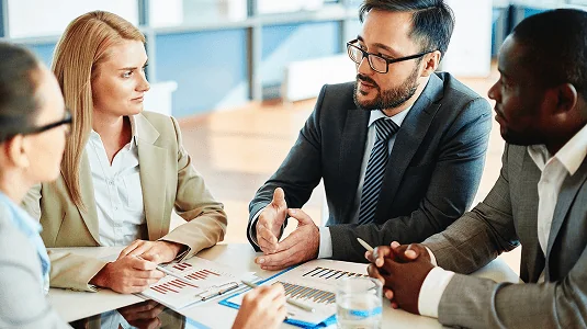 Business professional taking notes during a legal consultation.
